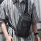 Men's black crossbody chest bag with multiple front zippers and detachable strap hook