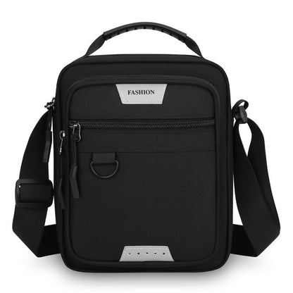 Men's black crossbody bag with top handle and front zip pocket