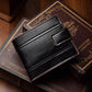 Black leather bi-fold wallet with card slots and front buckle tab detail.