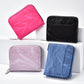 Set of four zipper coin card bags in pink, black, lavender, and blue faux-leather
