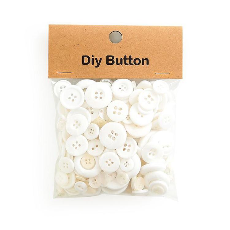 Round resin DIY buttons, white mix in sealed craft bag with kraft header