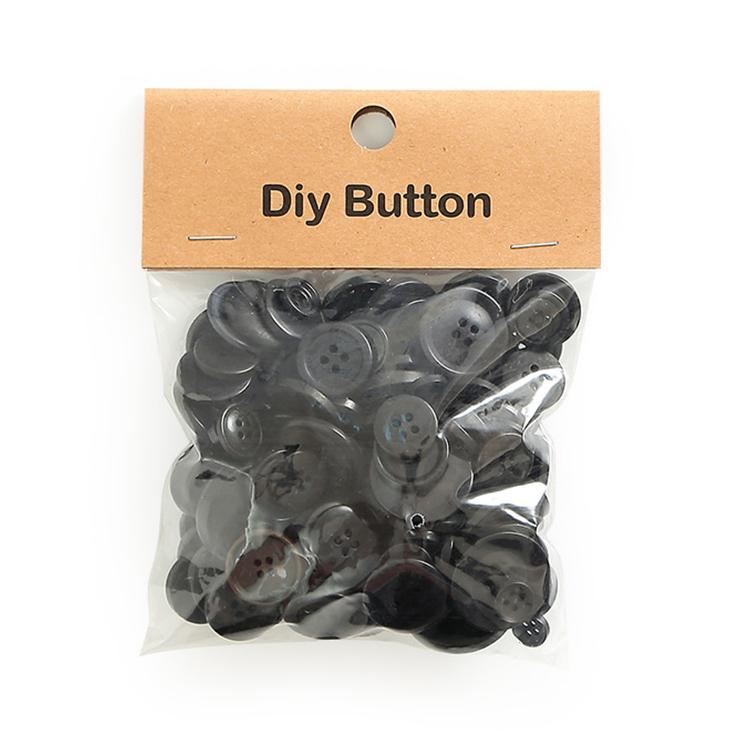 Round resin DIY buttons, dark gray mix with embossed hole patterns
