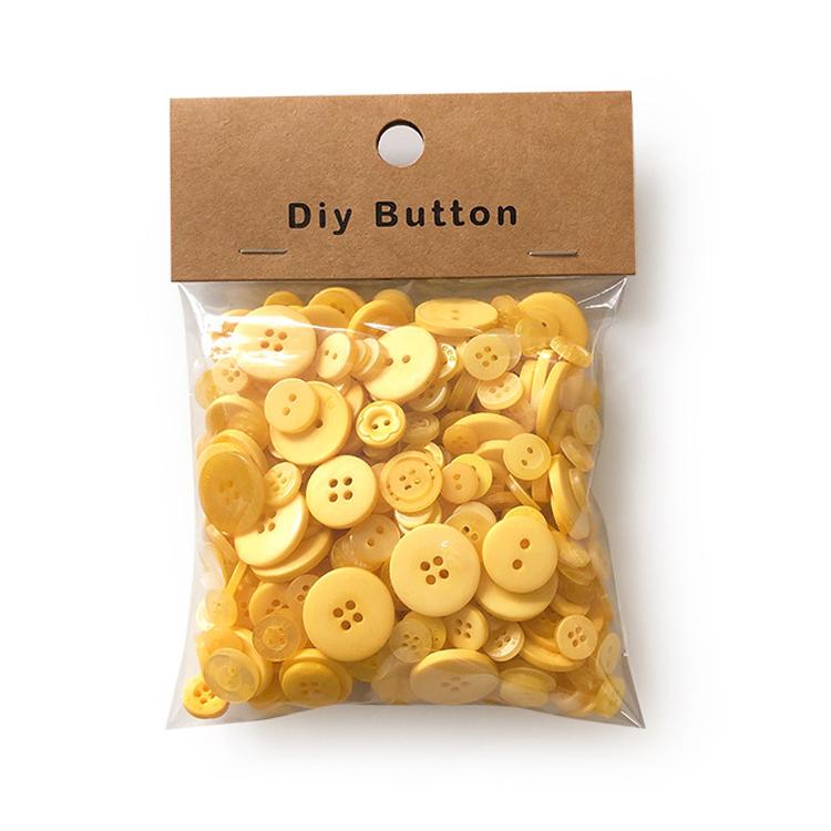 Pack of round resin buttons, yellow mixed sizes with 2-4 holes, in clear bag