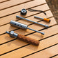 Camping blowtorch kit with stainless tube, wooden grip, and small adapter parts