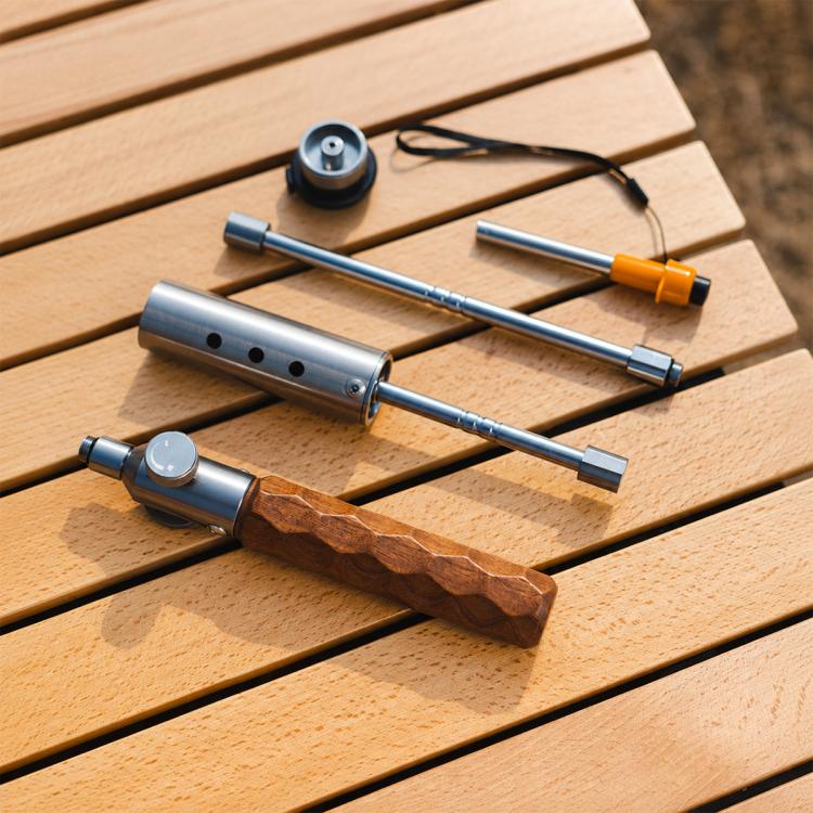 Camping blowtorch kit with stainless tube, wooden grip, and small adapter parts
