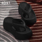 Black EVA thick-soled flip-flops with molded thong strap and raised platform sole