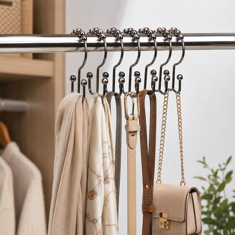 Mountain-shaped metal curtain hooks on rod with mixed metal finishes