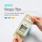 Light-colored index tab puncher open interior with hand aligning a paper tab