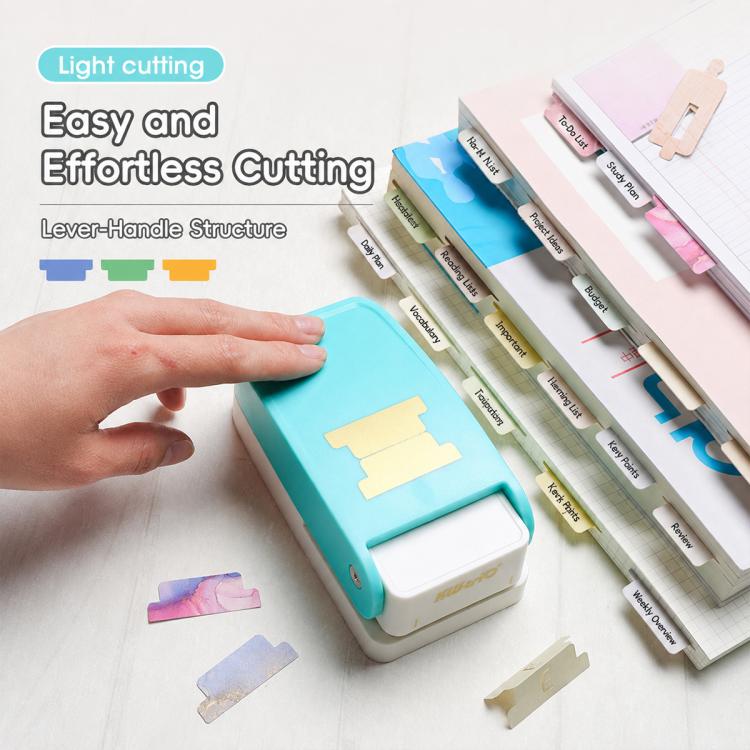 Turquoise index tab puncher with hand cutting and aligned paper label tabs