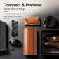 Tan leather watch storage case shown with compact carry accessories