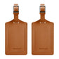 Pair of brown PU leather luggage tags with metal buckle and stitched edge.