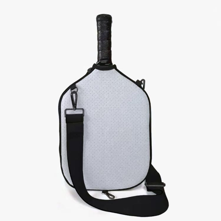 Light gray neoprene paddle bag with black shoulder strap and gold-tone hardware.