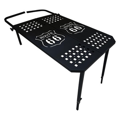 Portable folding metal dining table with perforated checkered top and cutout patterns.