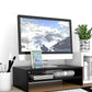 Black dual-tier monitor stand with phone holder and lower open storage shelf