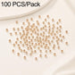 Gold-plated round spacer beads, smooth finish, straight holes; many beads in a pile.