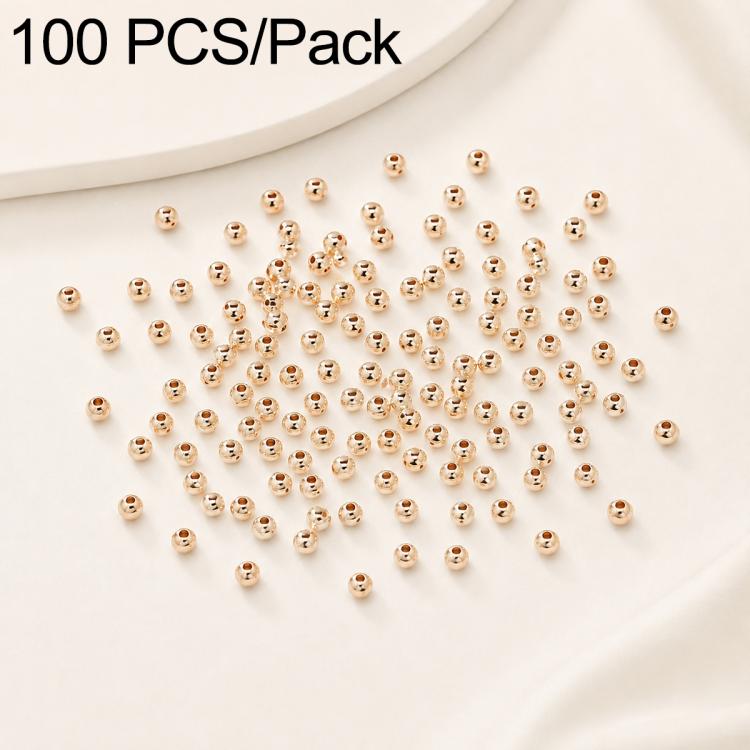 Gold-plated round spacer beads, smooth finish, straight holes; many beads in a pile.