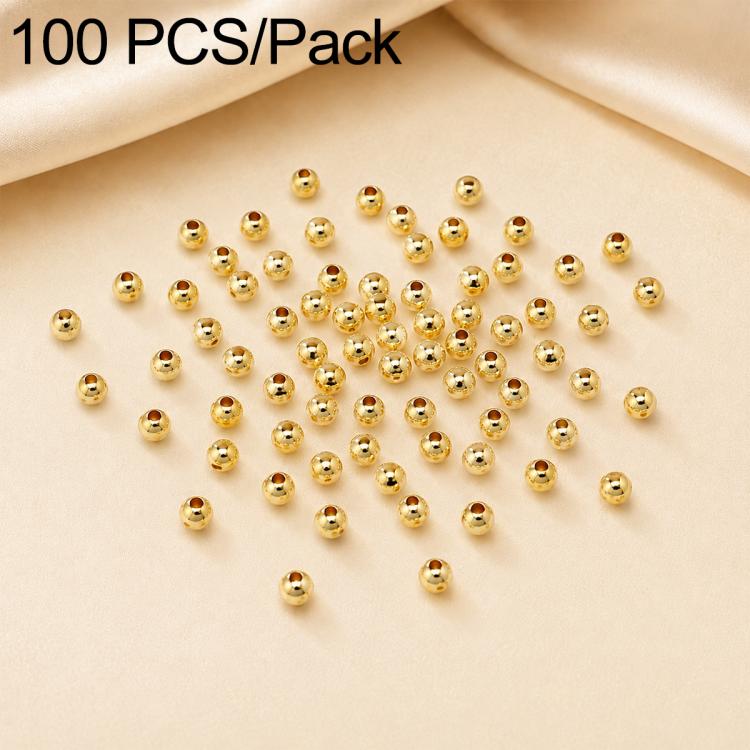 Gold-plated round spacer beads scattered, smooth finish, center holes, 100-piece pack