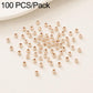 Gold-plated round spacer beads with straight holes, smooth surface; scattered pack.