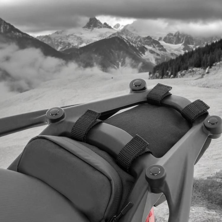 Black rear-rack tool bag secured with adjustable webbing straps and buckles