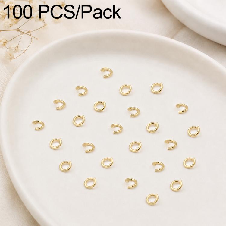 Gold open jump rings, small split rings laid out for DIY jewelry making