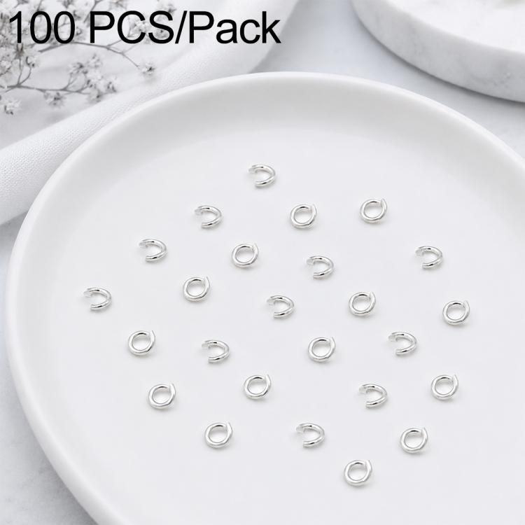 Silver open jump rings, small split rings arranged on a tray for DIY