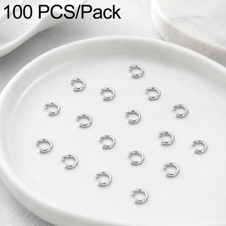 Silver open jump rings, small split loops arranged in a round dish