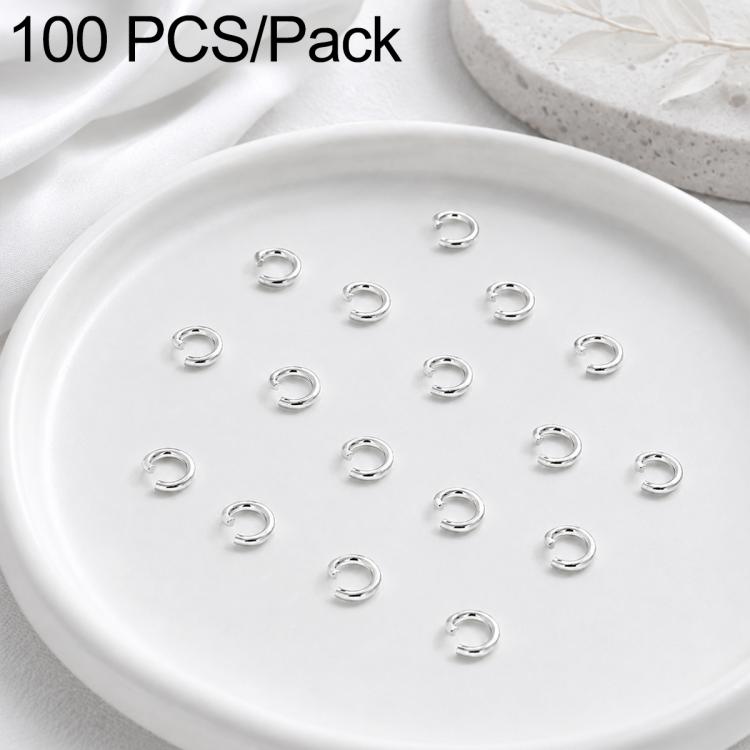 Silver open jump rings, small split rings displayed in a round dish