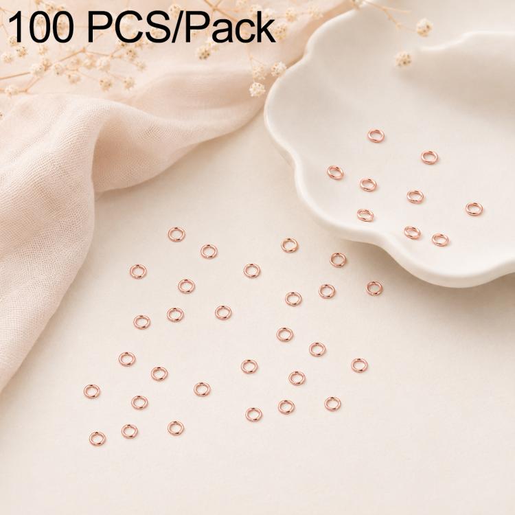 Rose gold open jump rings, 100-piece set scattered with some in a tray dish