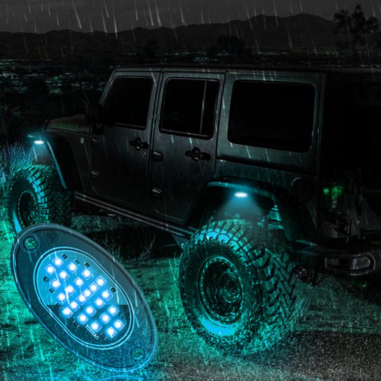 Waterproof LED rock light set with blue underglow, oval housing mounted on off-road vehicle