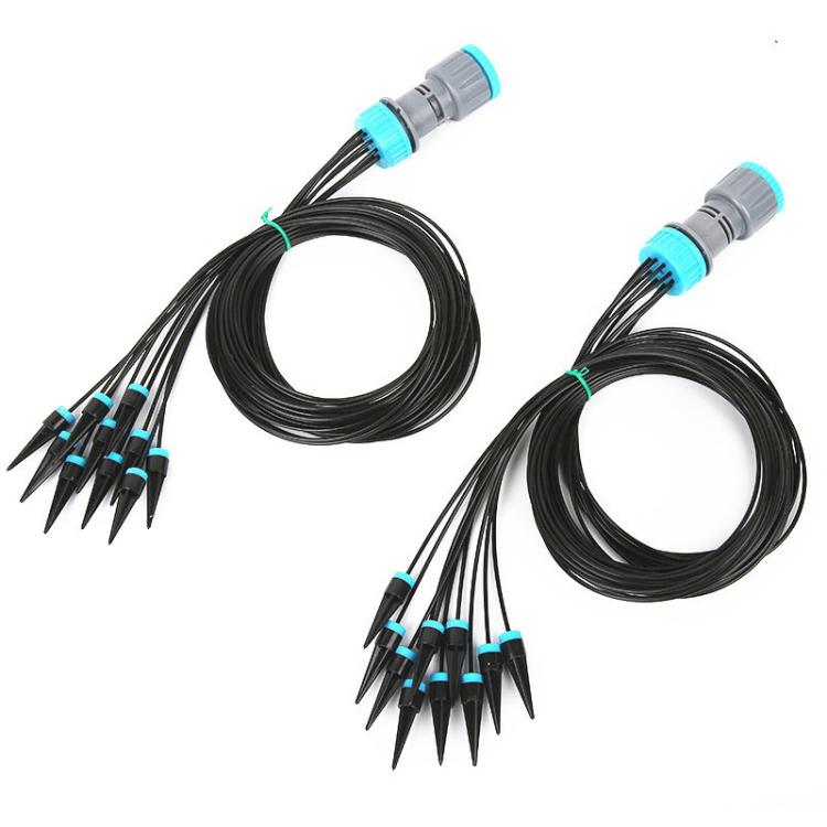 Drip irrigation set with black drip lines, pointed stakes, and blue hose fittings