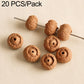 Light tan textured round seed beads with drilled holes on a pin for bracelet DIY