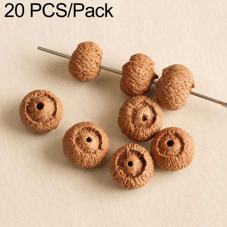 Light tan textured round seed beads with drilled holes on a pin for bracelet DIY
