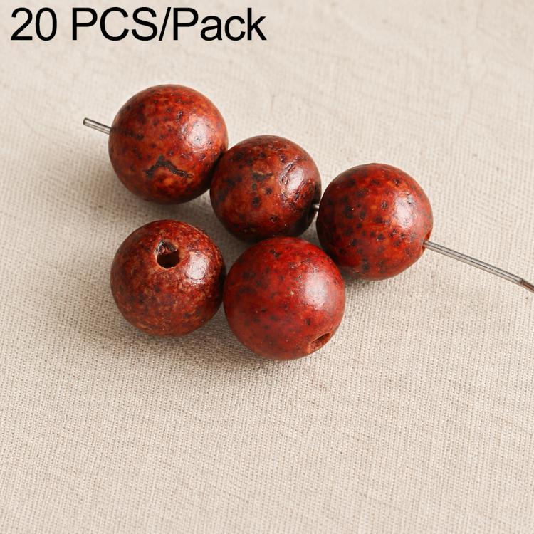 Reddish-brown round seed beads with small holes, strung on metal pin.