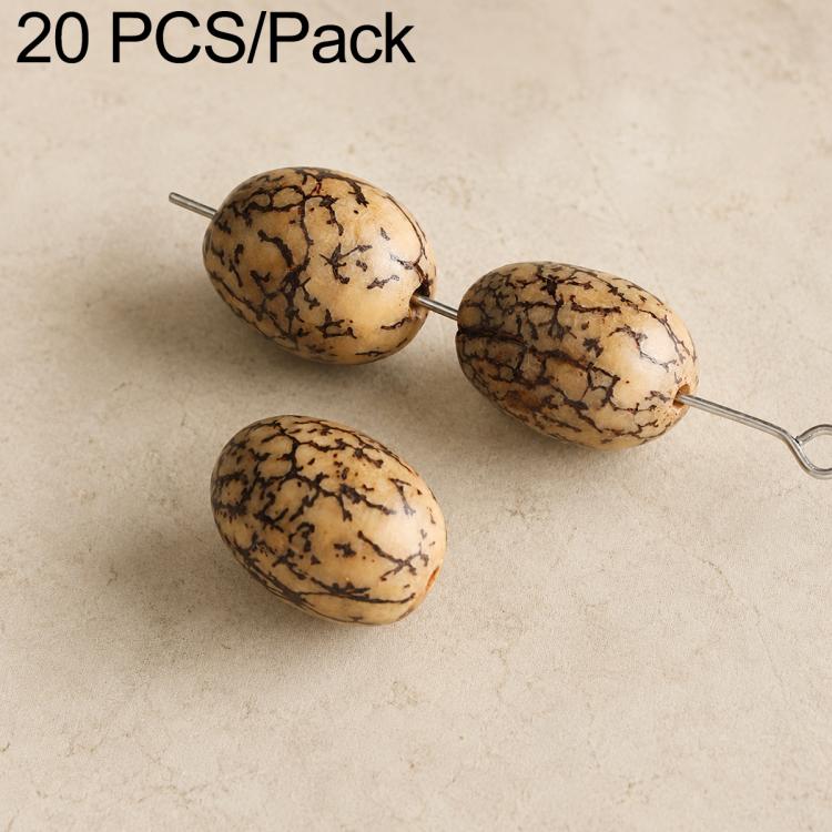 Cream oval seed beads with black speckled lines, strung on metal pins.