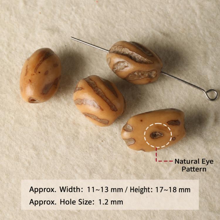 Natural amber patterned seed beads with small holes, including striped and eye-like shapes