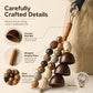 Handcrafted bead bag charm with wrapped hanging rope and coconut shell bells