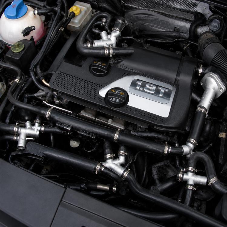 Engine coolant hose connector set installed in engine bay, metal fittings and pipes