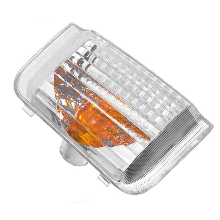 Angled turn signal light with clear cover and orange reflector LED cells