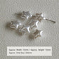 Set of glossy white star faux pearl beads on metal pin stems