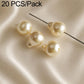 Cream teardrop faux pearl beads with metal pin stems for DIY crafts