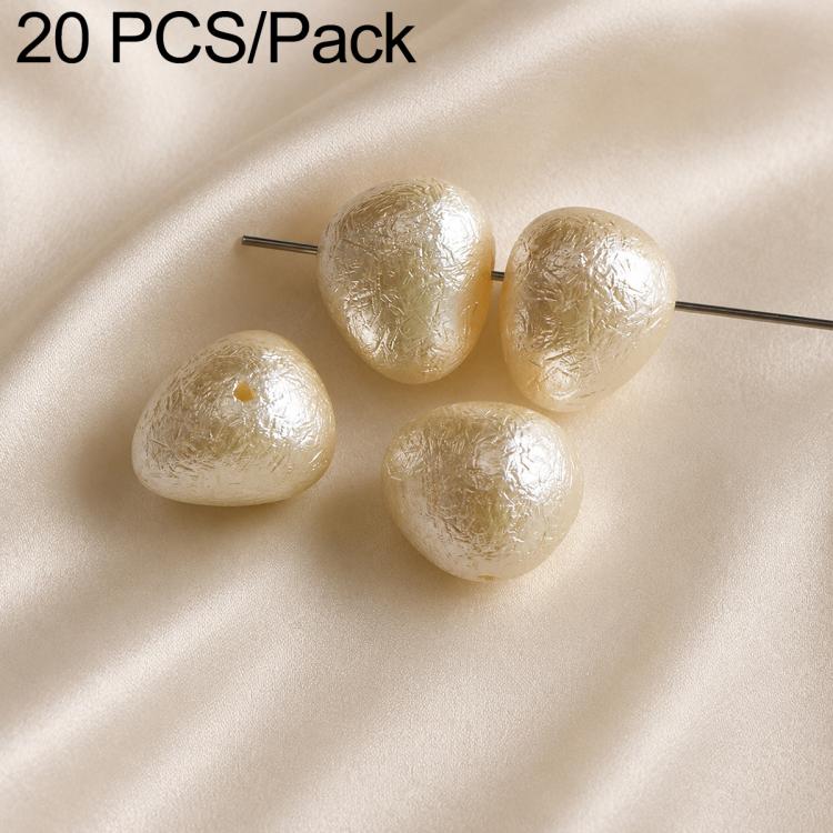 Ivory teardrop faux pearl beads with textured surface on metal pin stems