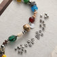 DIY phone charm strand with silver spacer beads and mixed colored accent beads