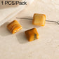 Square amber orange stone beads on wire pin with translucent banding