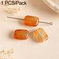 Rectangular amber orange stone beads on wire pin, translucent facets