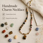 Handmade charm necklace with natural stone beads and gold-toned clasp