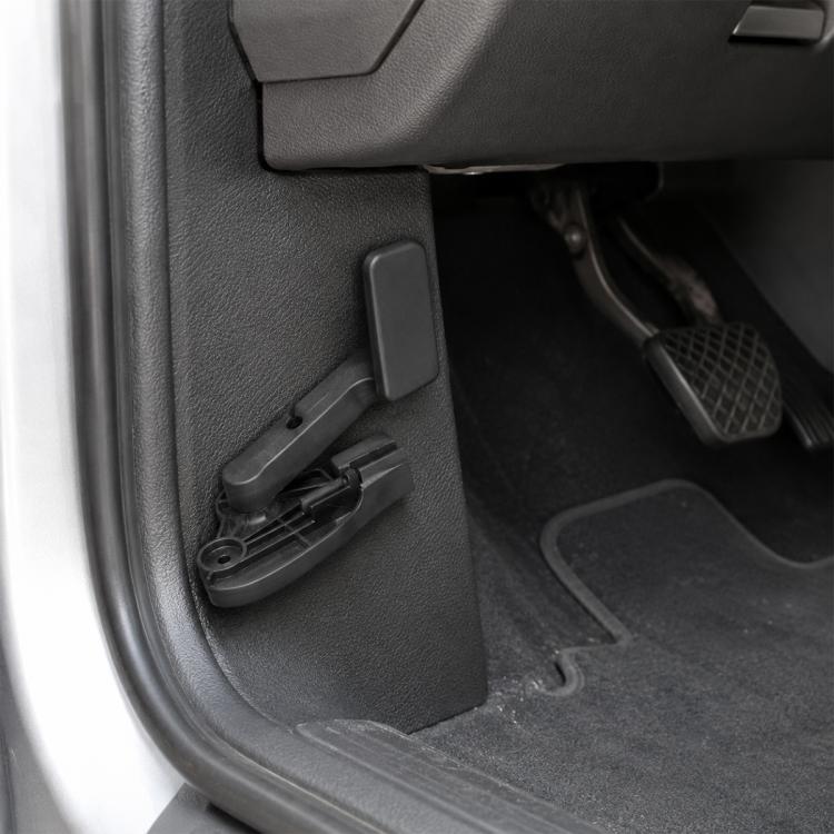 Black hood release handle lever on car door panel trim