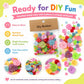 Assorted resin buttons in a retail paper card pack, colorful DIY craft pieces