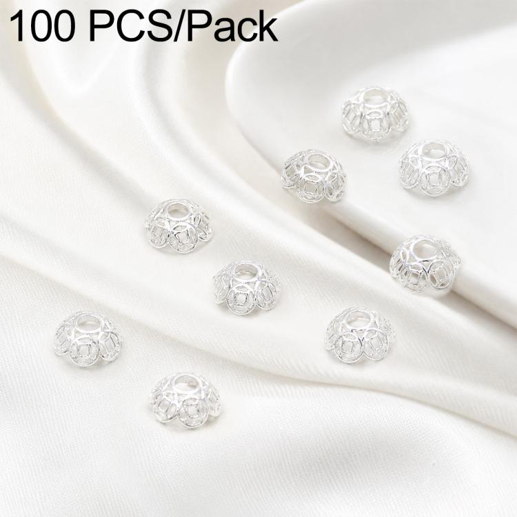 Silver flower bead caps, partially angled view with central hole and open metalwork