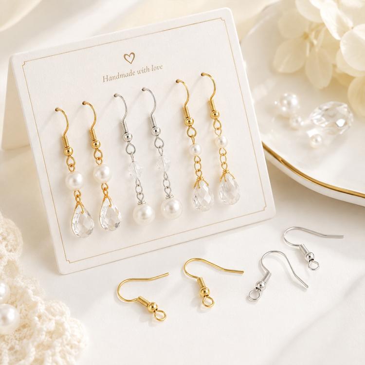 DIY earring hook display card with mixed gold, silver, and clear charm earring parts