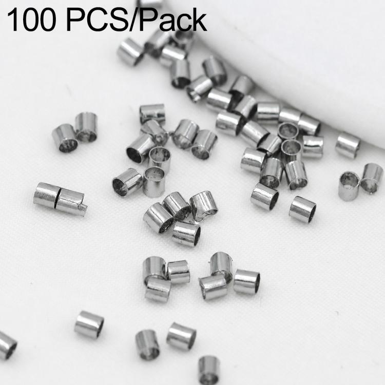 Silver-tone crimp end beads, close-up pile of small metal tube separator clips